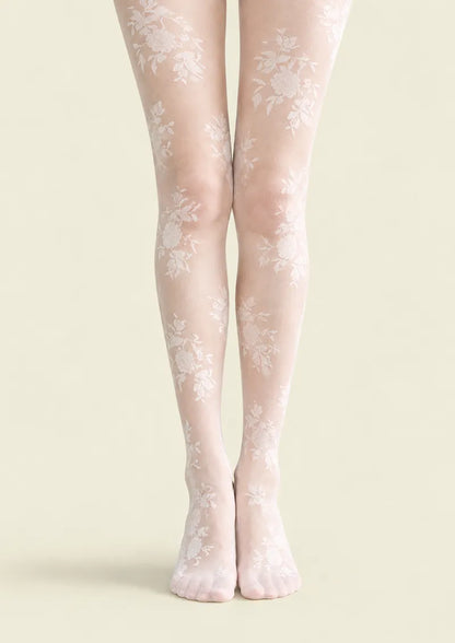 White printed tights with scattered rose bouquets and delicate lace-effect floral details along the legs and feet