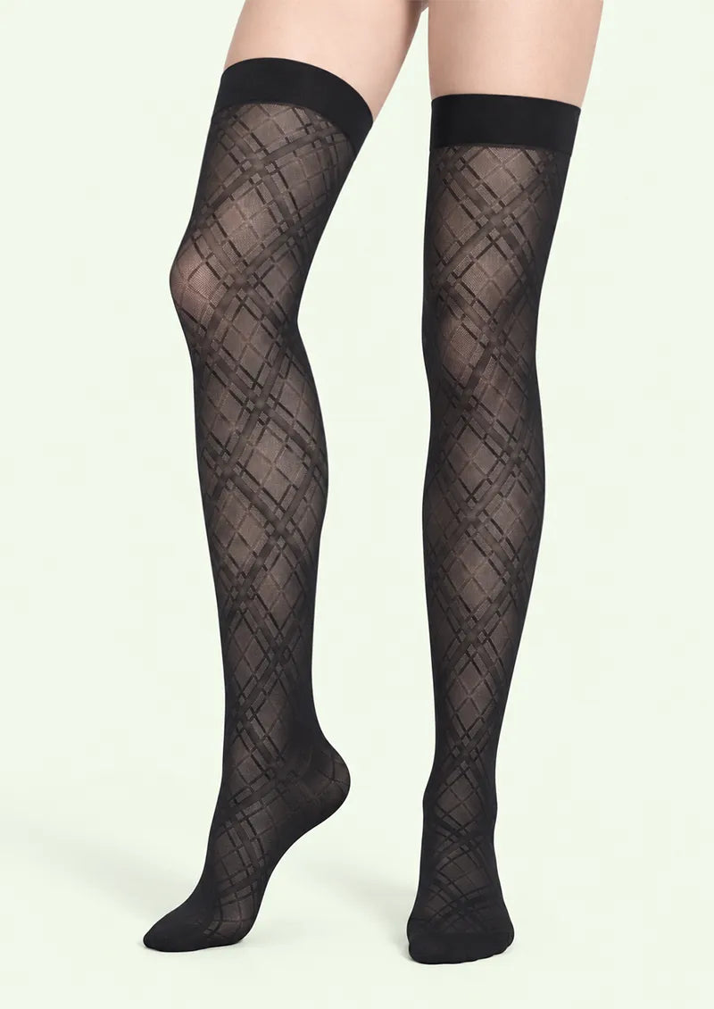 Black printed knee stockings with intersecting diagonal lines forming a diamond lattice and a solid black top band.