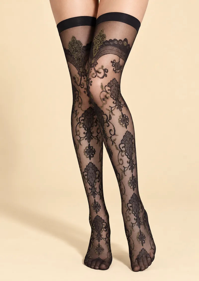 Black printed knee stockings with openwork floral motifs, scrolling vines, and bronze-toned decorative accents.