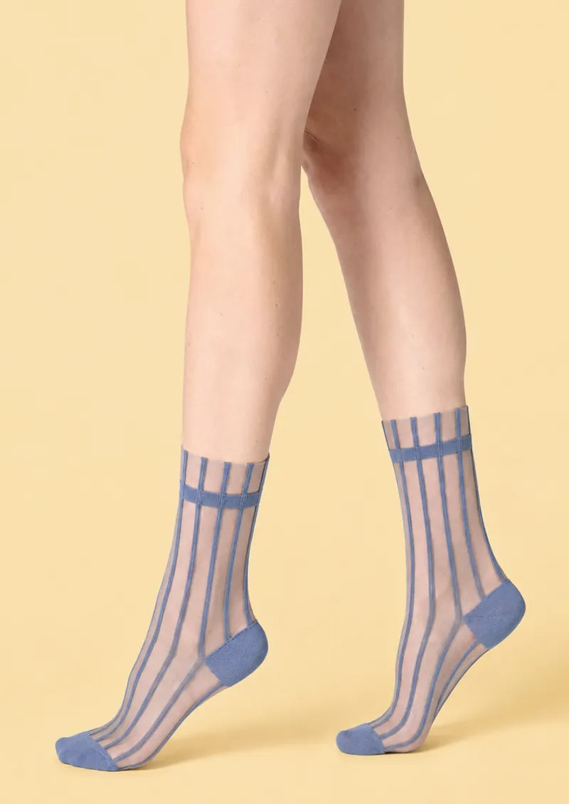 Model wearing Dusty Blue Sheer Vertical Stripe Crew Socks