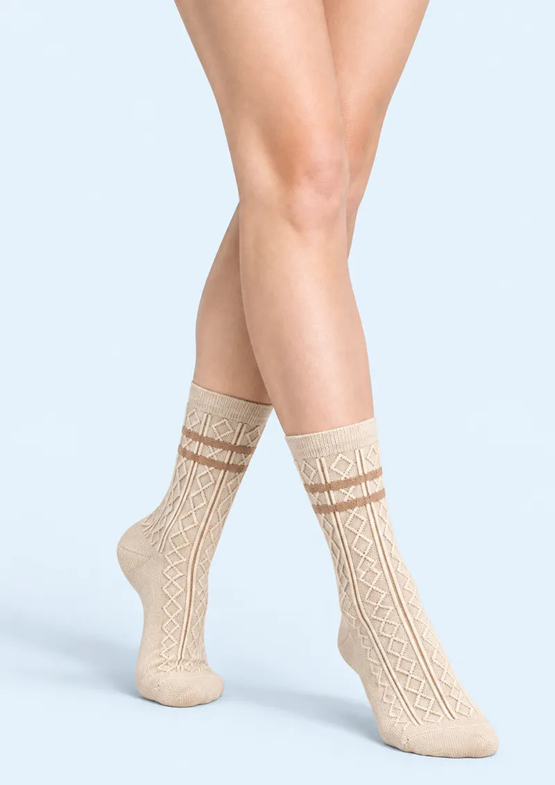 Top view of beige Crew Socks with raised vertical diamond motifs, narrow ribbing and brown horizontal bands.