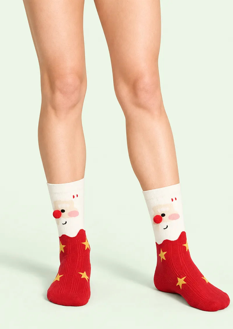 Front view of white and red Crew Socks with a Santa face motif, yellow stars, and a red pom-pom nose
