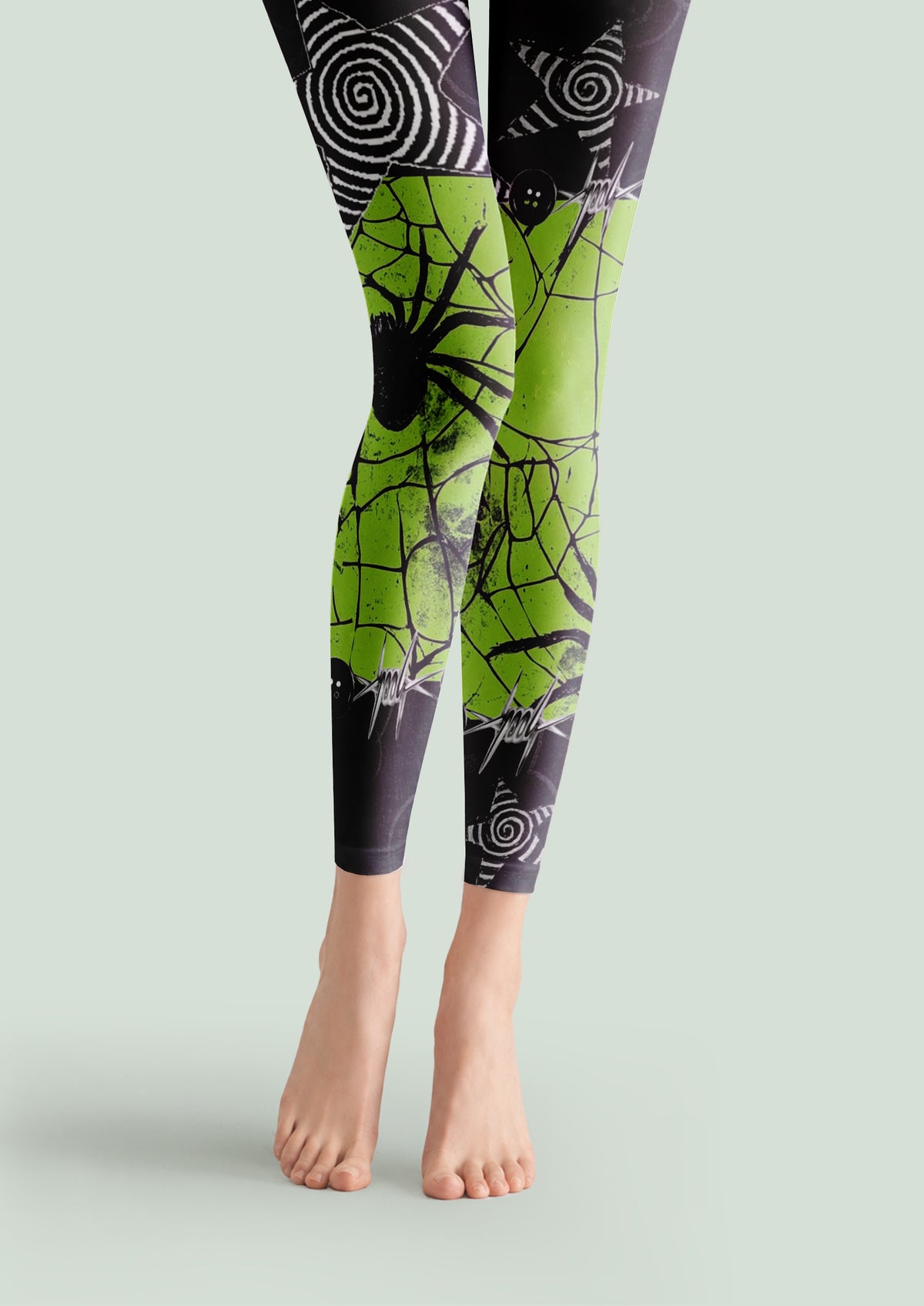 Black and green printed footless tights with spider web novelty graphic patterns