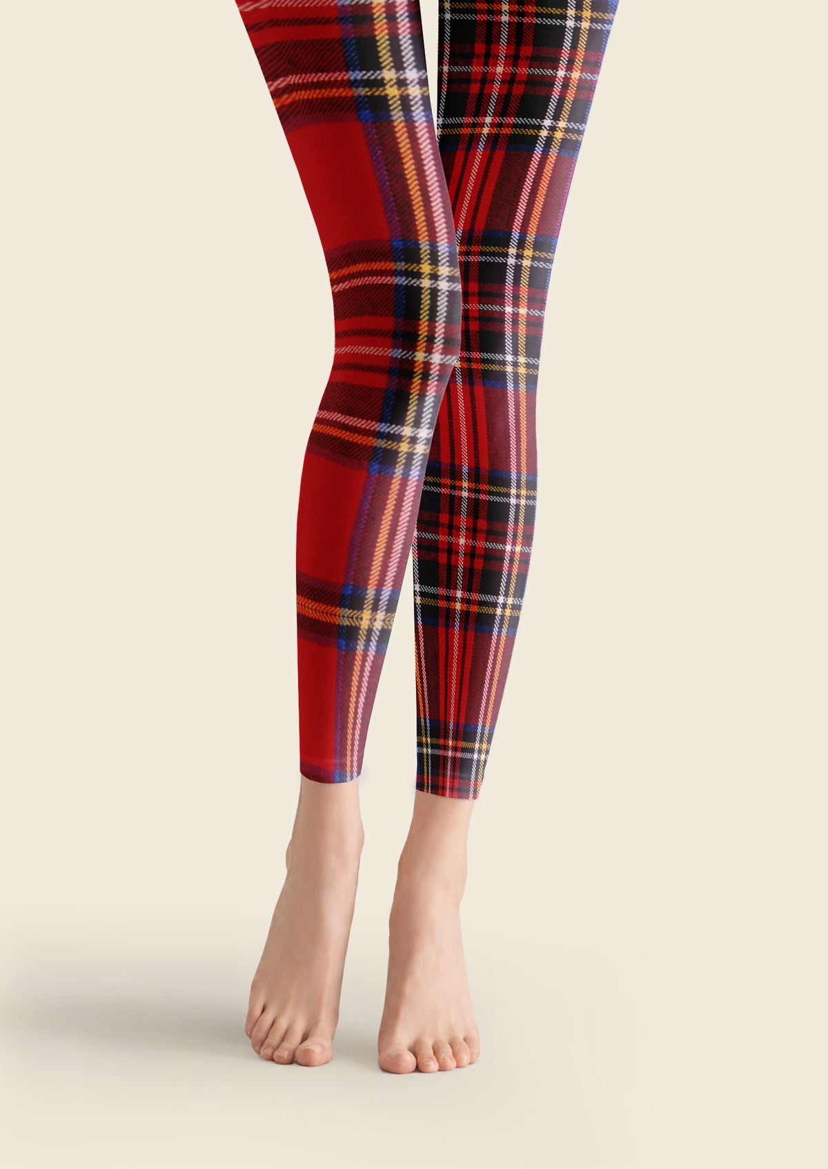 Red printed footless tights with asymmetric tartan plaid, black and navy checks, and fine yellow and white intersecting lines.