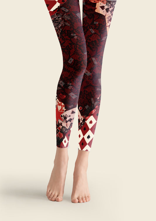 Black and burgundy printed footless tights with playing cards, dice, floral lace patterns and red and ivory diamond panels.