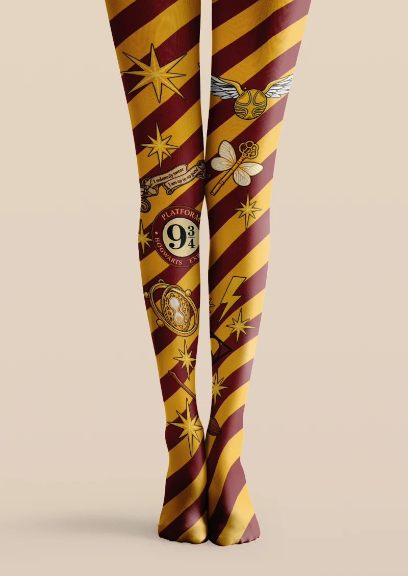 Yellow and burgundy printed tights with diagonal stripes, stars, key and illustrated symbols