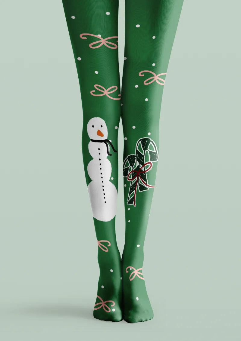 Green printed tights with a white snowman, candy canes, pink ribbon bows, and scattered white dots.
