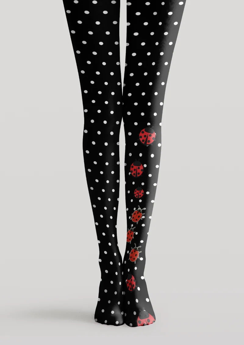 Black printed tights with white polka dots and red ladybug illustrations