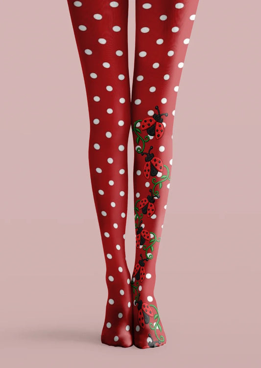 Red printed tights with white polka dots, green curling vines and ladybug illustrations