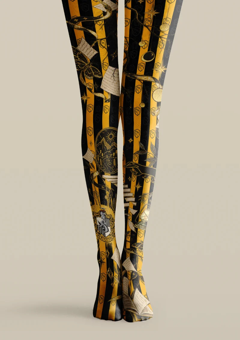 Black and yellow printed tights with vertical stripes, books, stars and celestial motifs