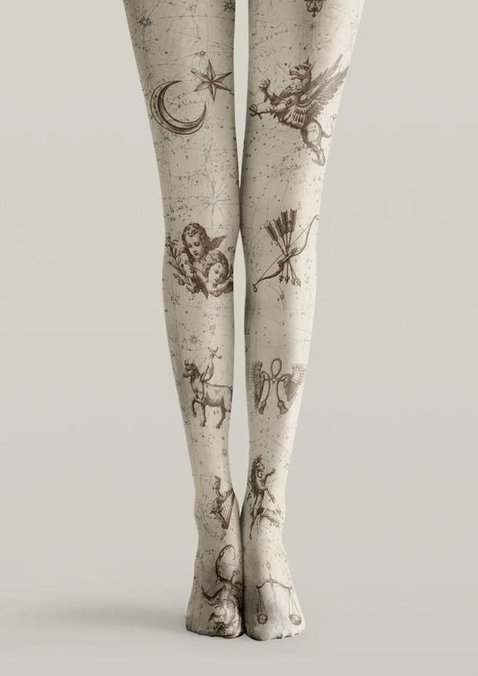 Ivory printed tights with brown zodiac illustrations, a crescent moon, stars, scales, a scorpion, and fine connecting lines.