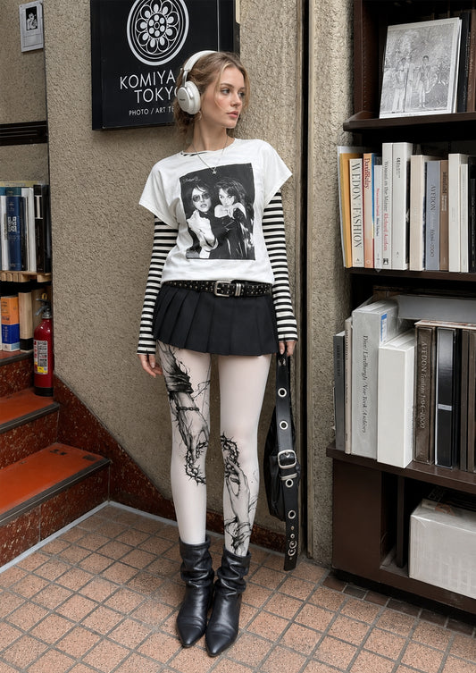 Model wearing Black Thorn Heart Chain Hands Tattoo Tights in a styled outfit