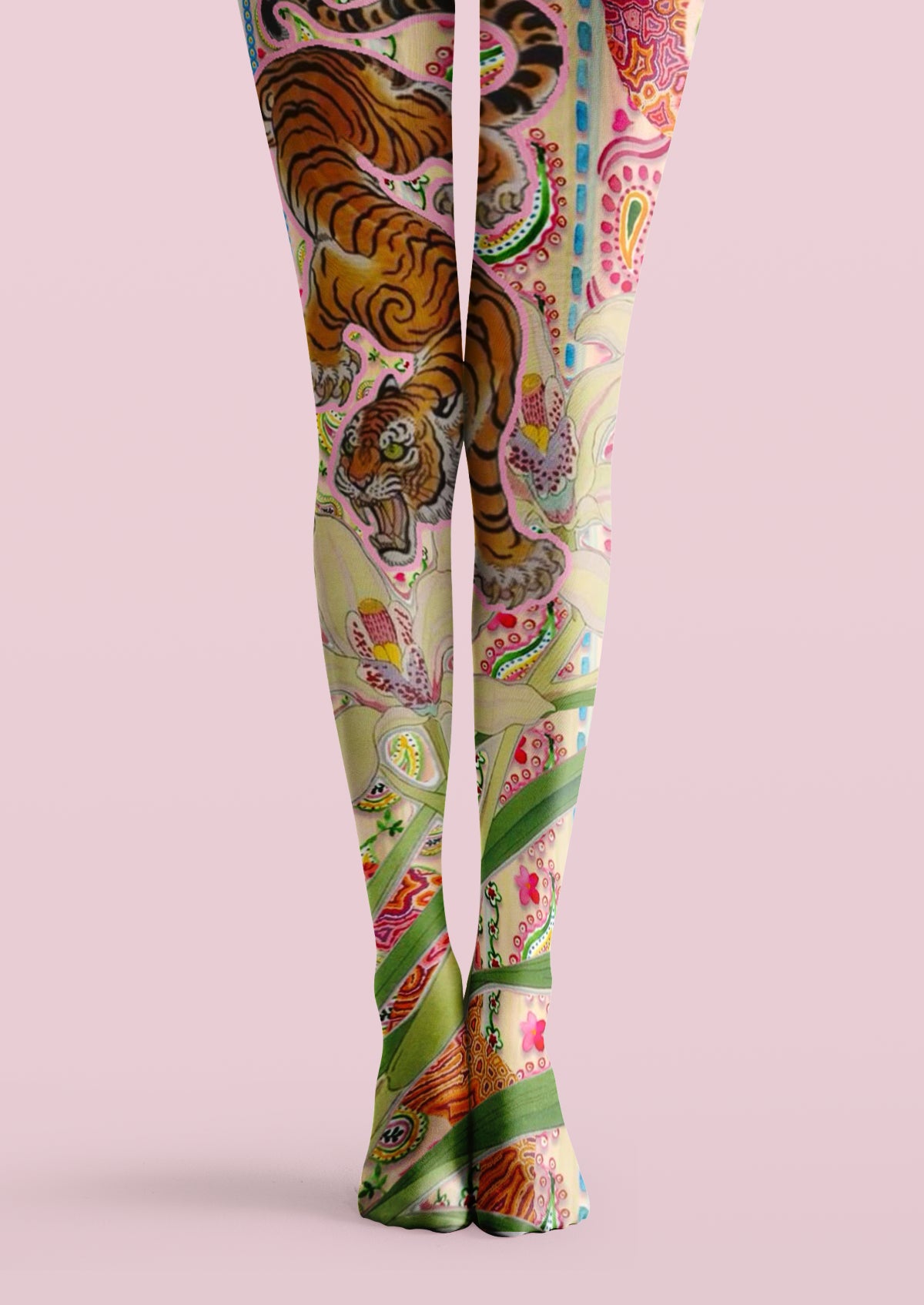 Beige printed tights with orange tiger illustrations, green leaves, floral details, and colorful paisley accents