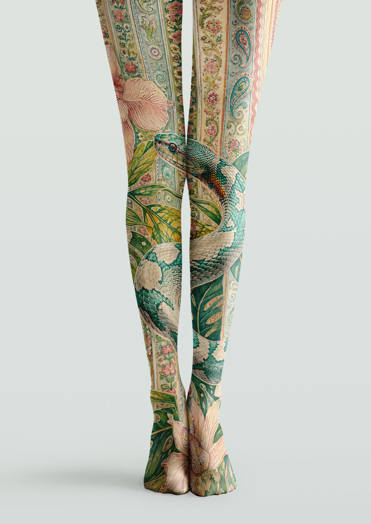 Green and beige printed tights with an illustrated snake, pink flowers, leafy motifs, and paisley-inspired bands