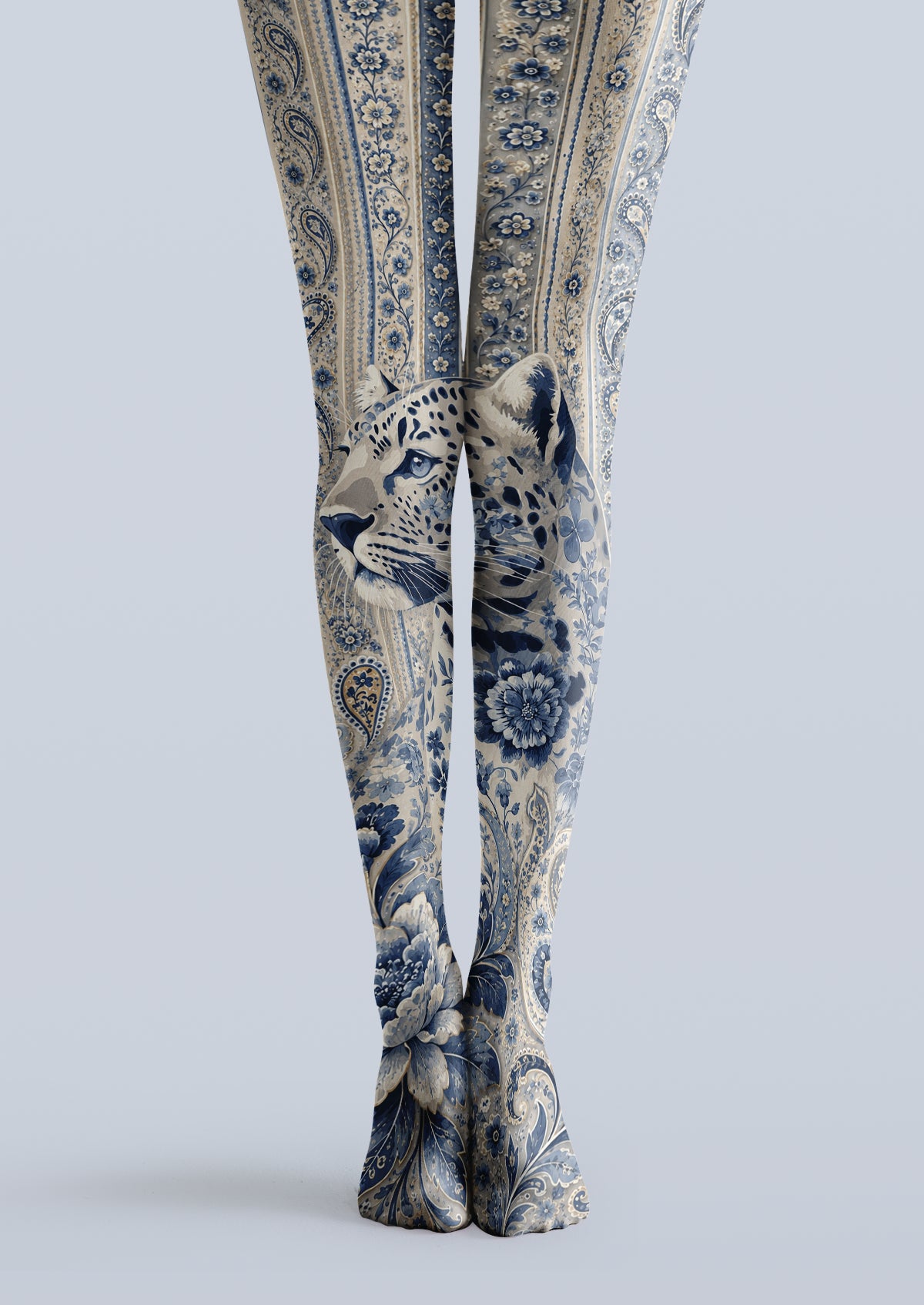 Beige and blue printed tights with a large leopard illustration, floral bands, and paisley-inspired details