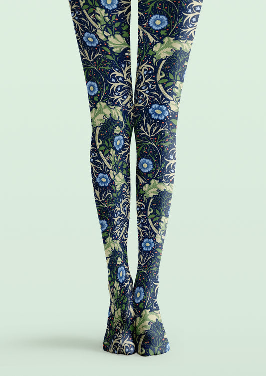Navy William Morris printed tights with blue flowers, green foliage and ornate botanical vines