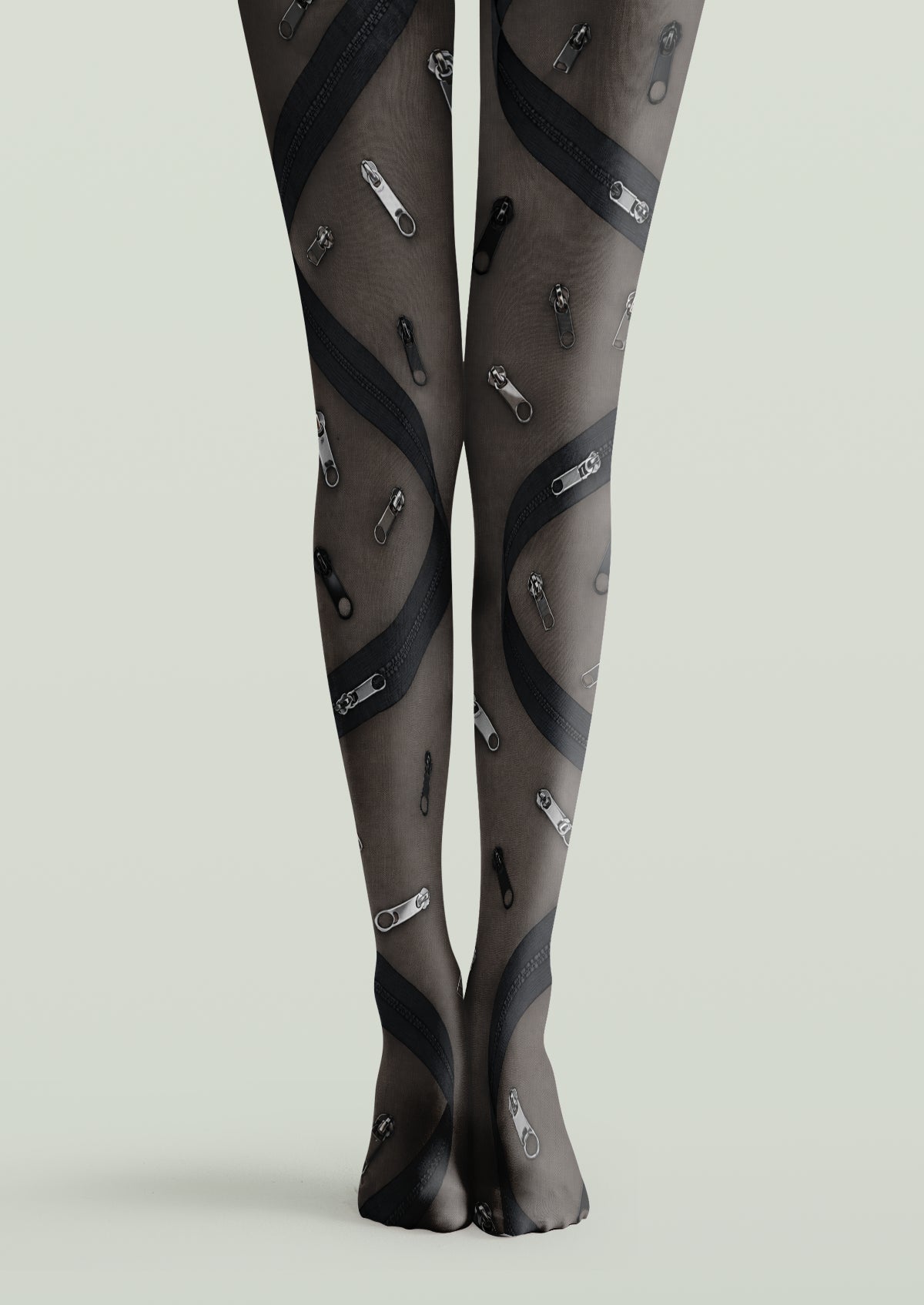 Black printed tights with scattered zipper pulls and curved zipper bands in gray and black