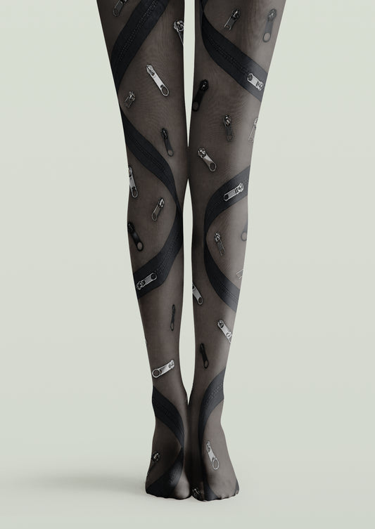 Black printed tights with scattered zipper pulls and curved zipper bands in gray and black