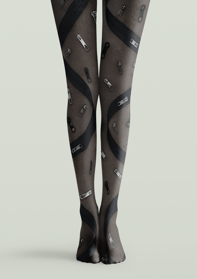 Black printed tights with scattered zipper pulls and curved zipper bands in gray and black