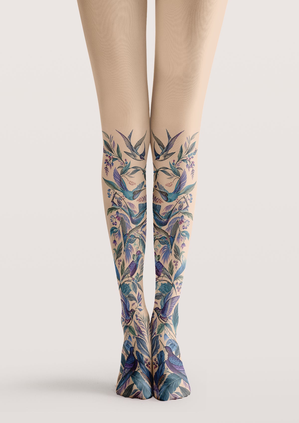 Beige printed tights with blue and purple birds, leafy branches, berries and botanical floral details