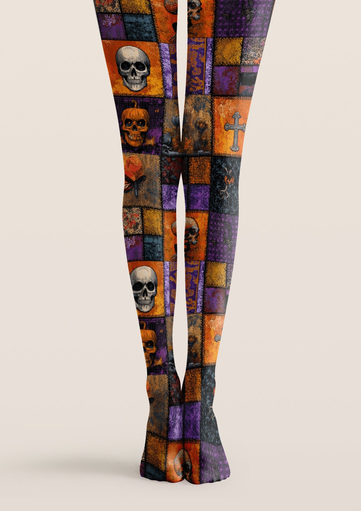 Orange printed tights with plaid patchwork, skull and pumpkin motifs covering legs and feet