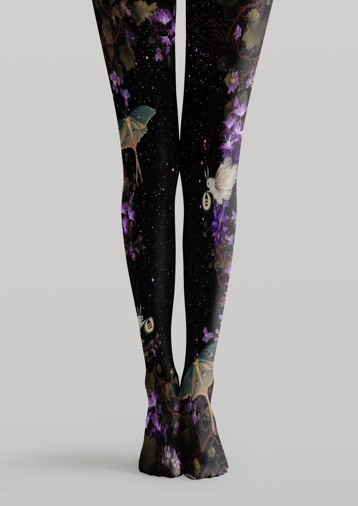 Black printed tights with purple flowers, green moths, glowing lanterns, winding vines and stars.
