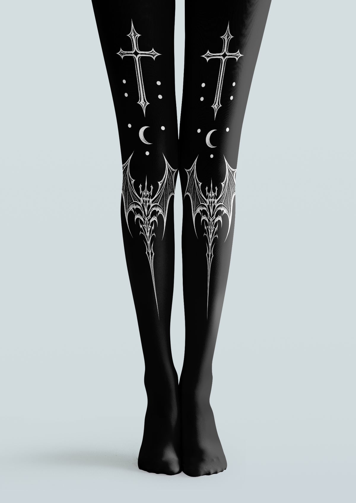 Black printed tights with white gothic crosses, crescent moons, dots and ornate bat-wing motifs