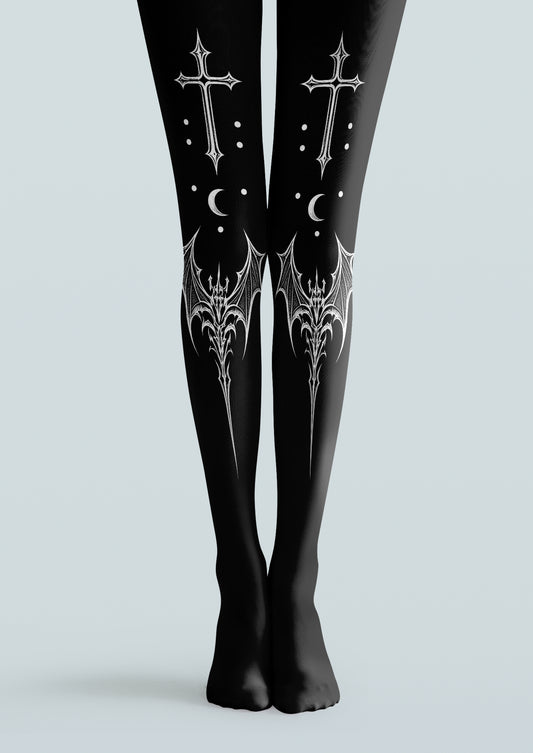 Black printed tights with white gothic crosses, crescent moons, dots and ornate bat-wing motifs