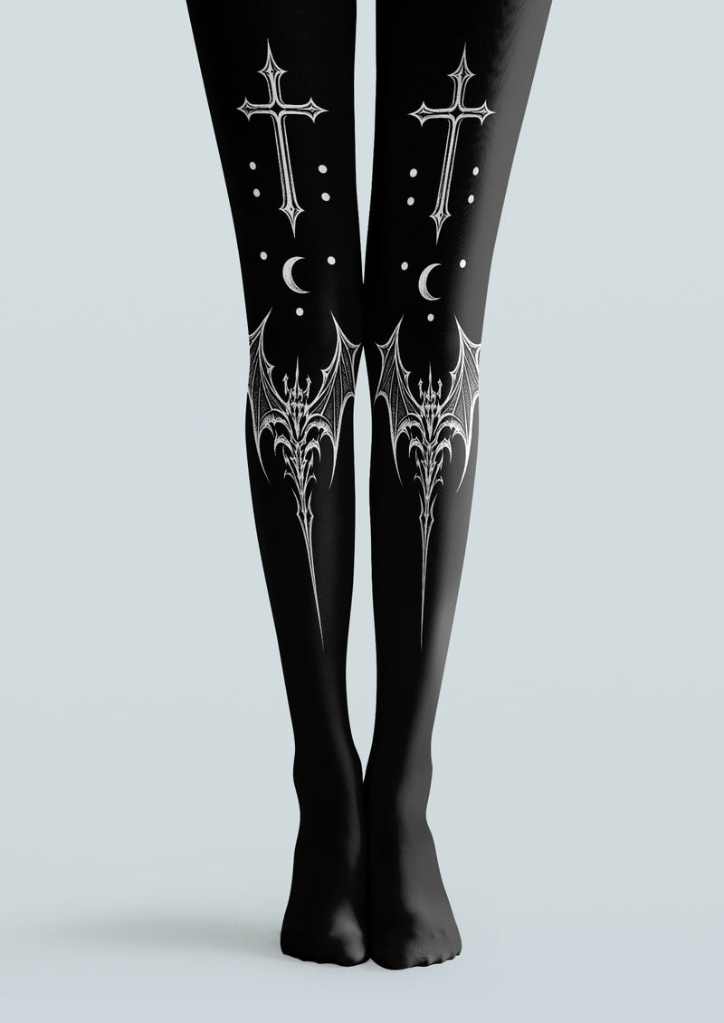 Black printed tights with white gothic crosses, crescent moons, dots and ornate bat-wing motifs