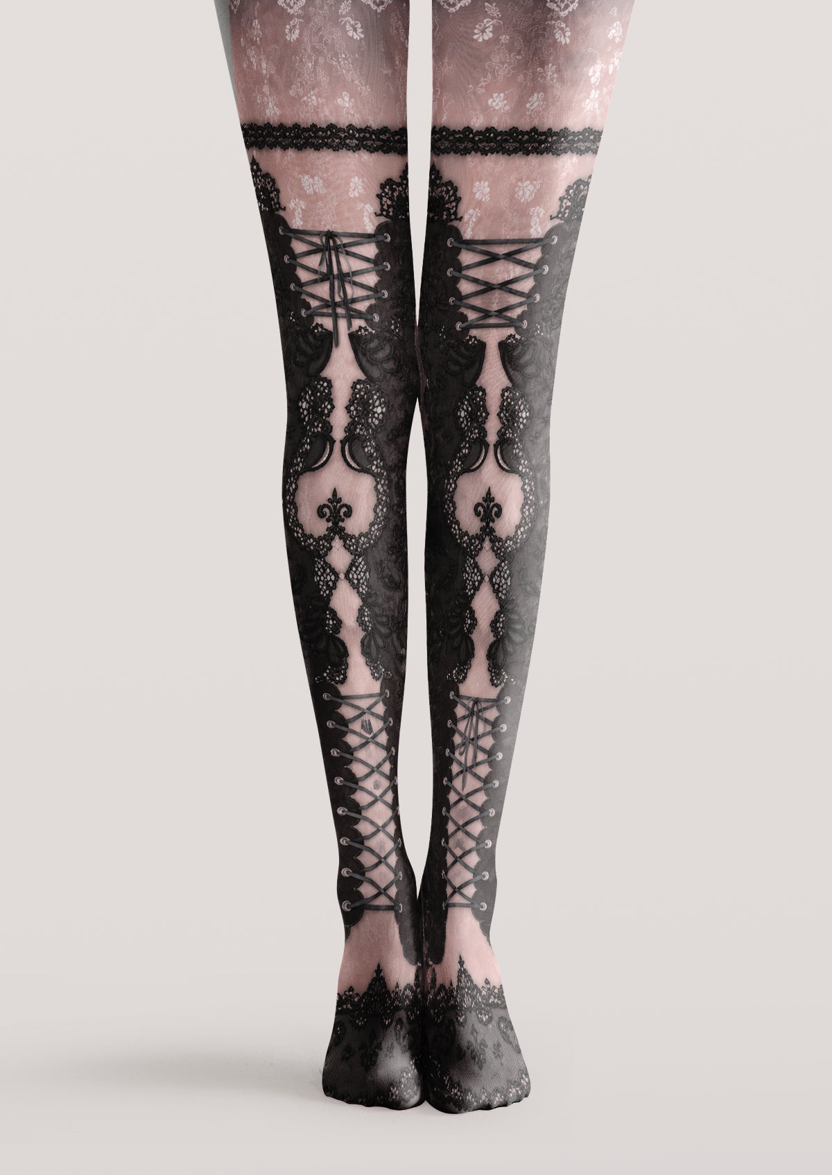 Pink printed tights with black corset-style lacing, ornate lace panels and delicate floral motifs