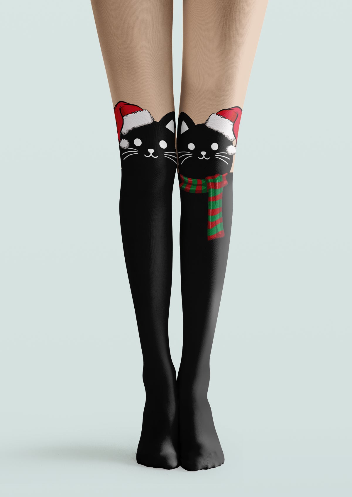 Black printed tights with Santa-hat cat faces, red and green accents, and a faux over-the-knee design