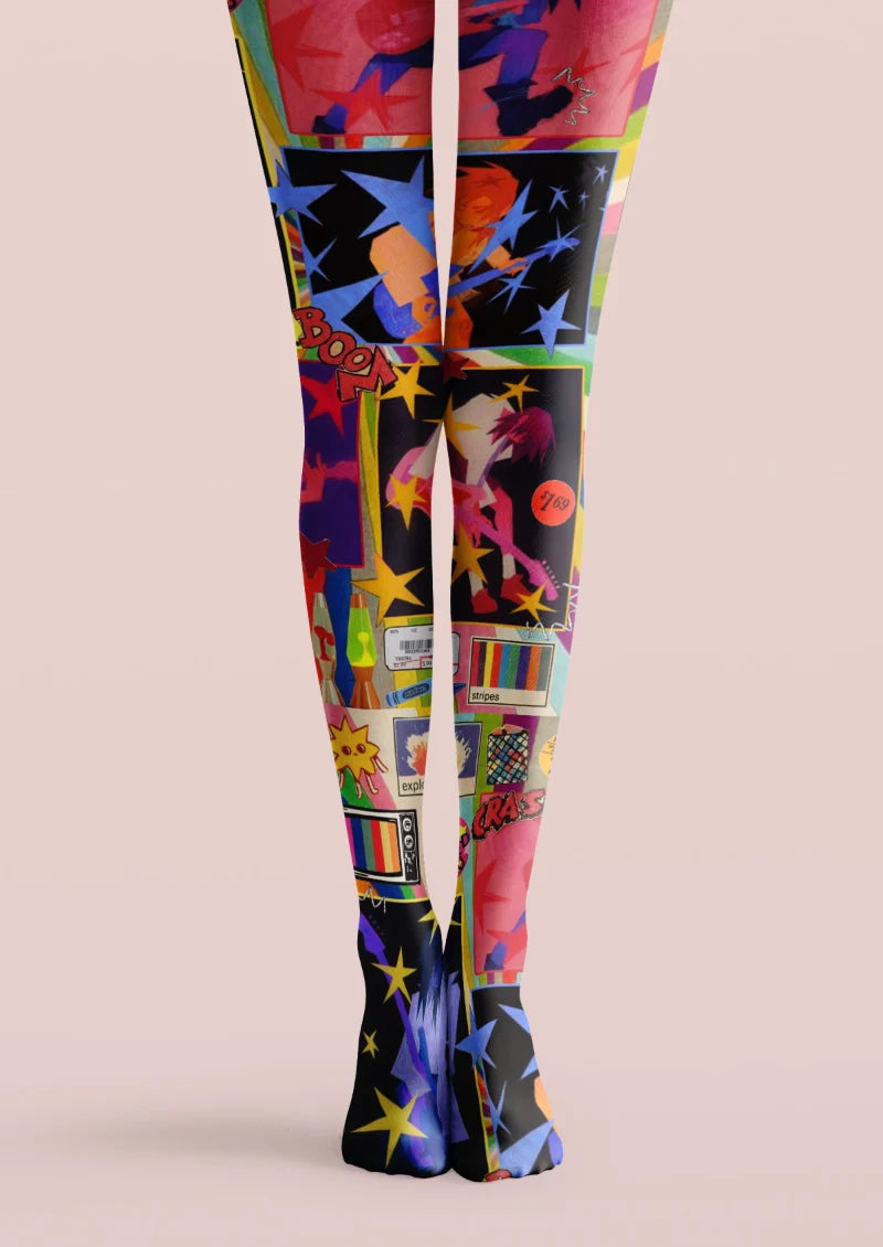 Black tights with pink and blue comic panels, illustrated figures, yellow stars, lettering, and television graphics