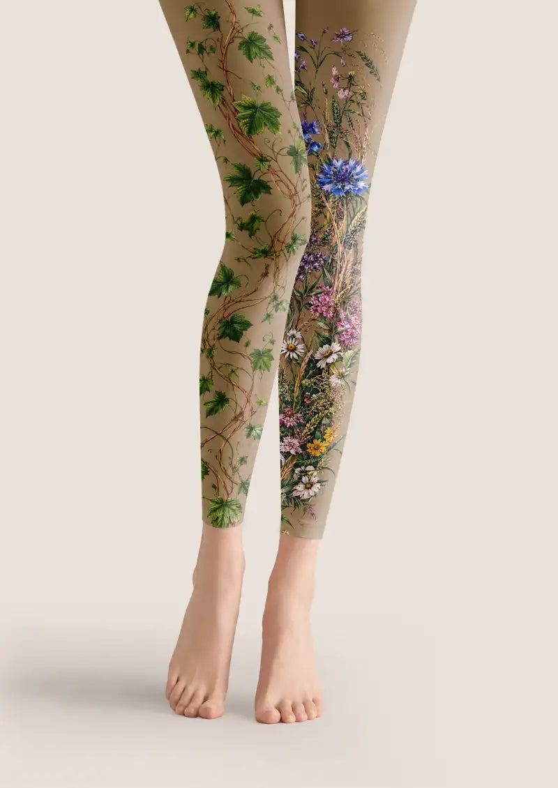 Beige printed footless tights with green vines and colorful floral botanical patterns