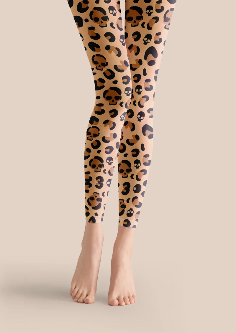 Beige printed footless tights with black and brown leopard spots and skull motifs