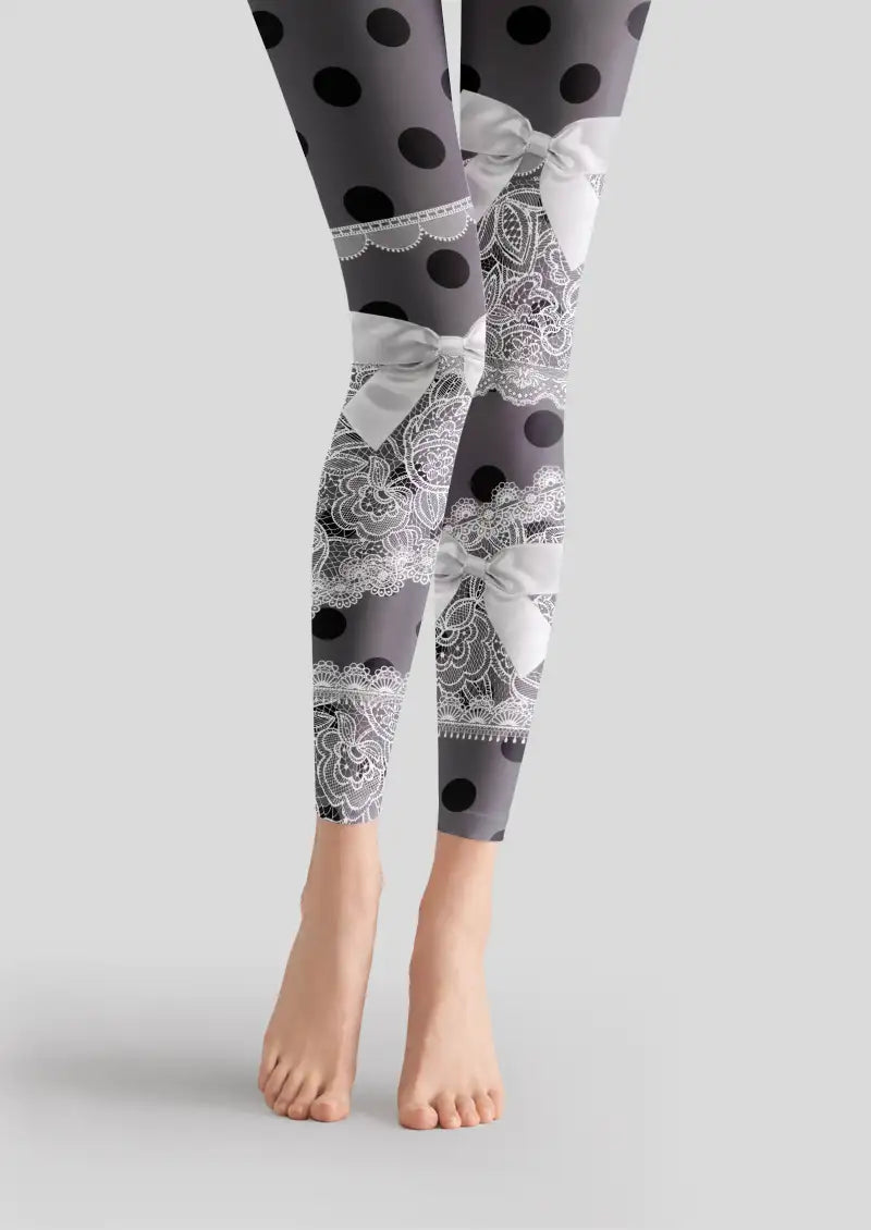 Black printed footless tights with white lace patterns, bows and polka dots
