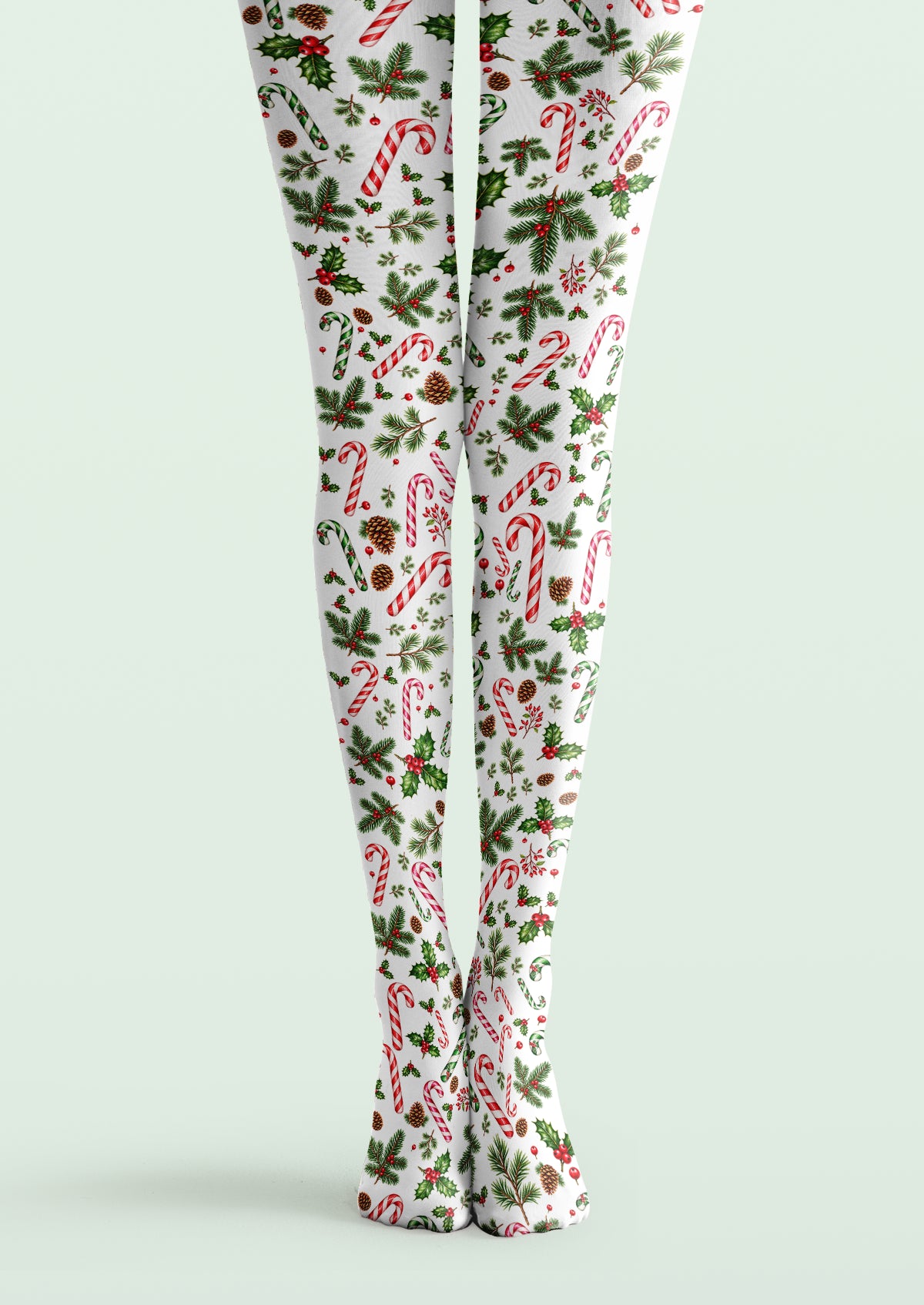 White printed tights with red and green candy canes, holly leaves, berries, pine sprigs, and brown pinecones