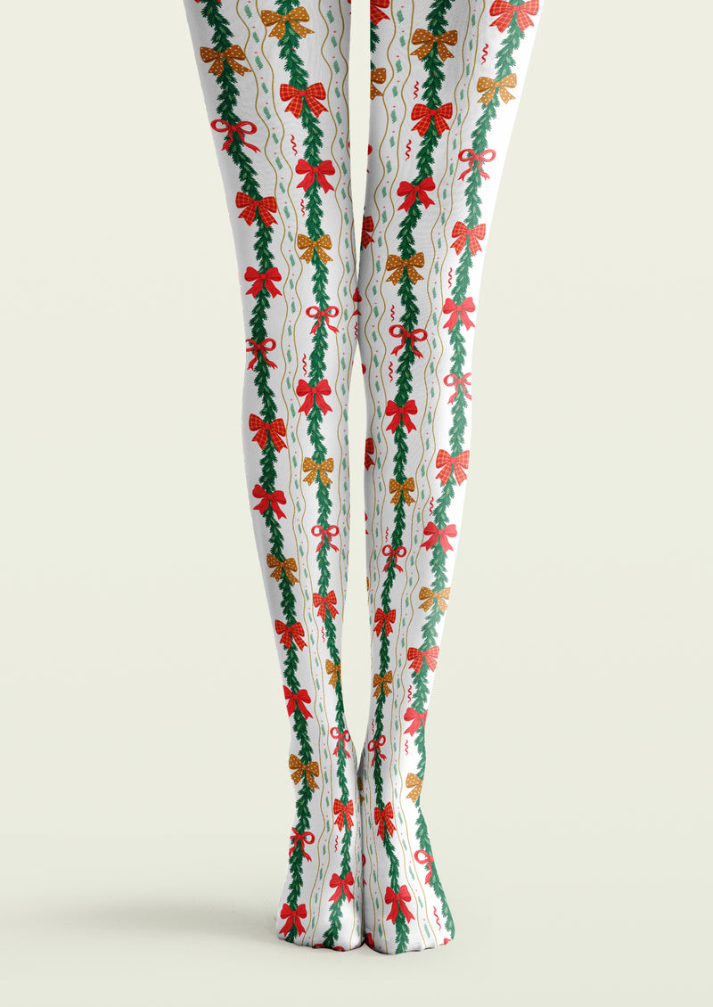 White printed tights with vertical green garlands, red bows, checked and dotted bows, and fine wavy lines