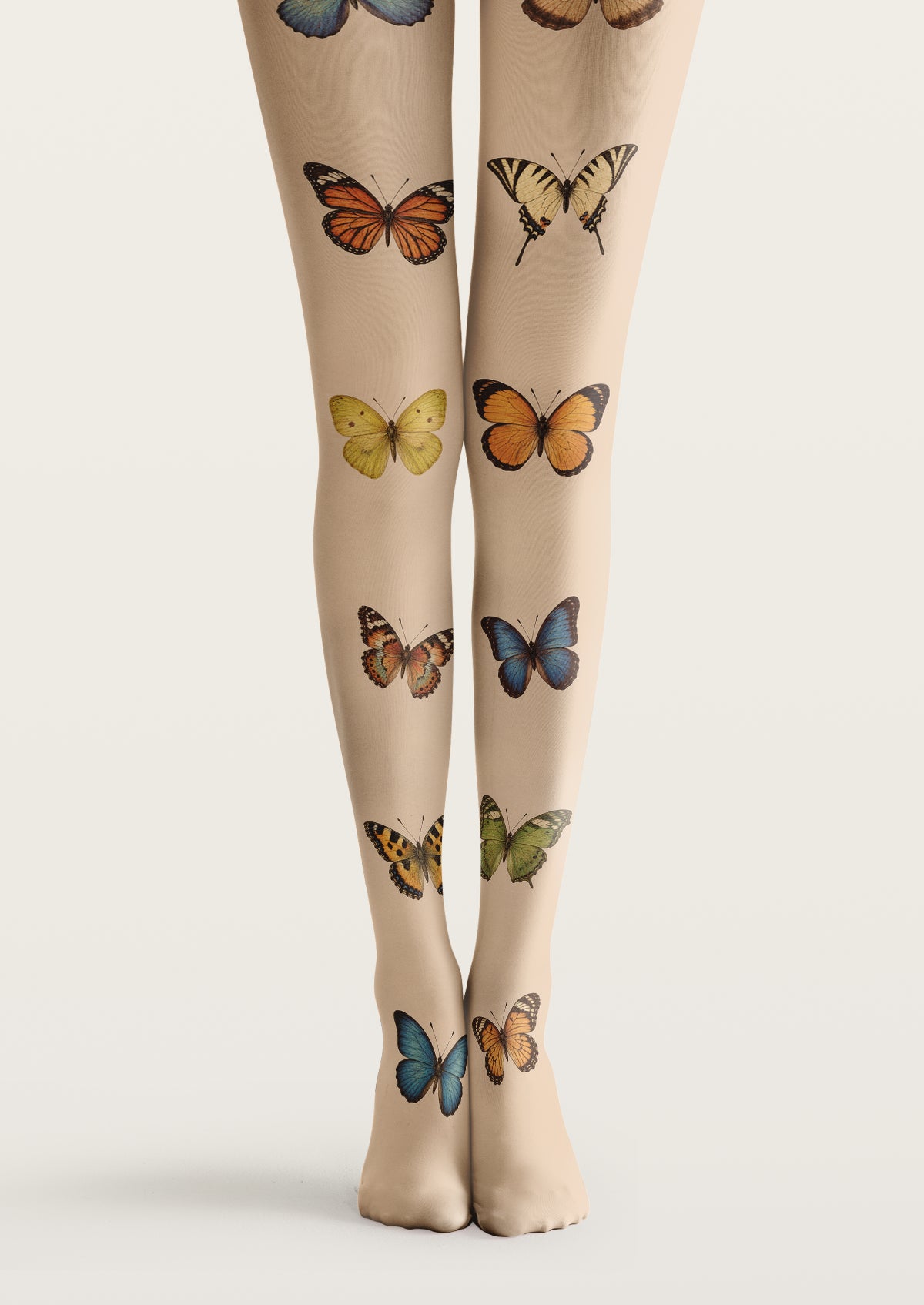 Beige printed tights with orange, blue, yellow, and green butterfly illustrations spaced across both legs.