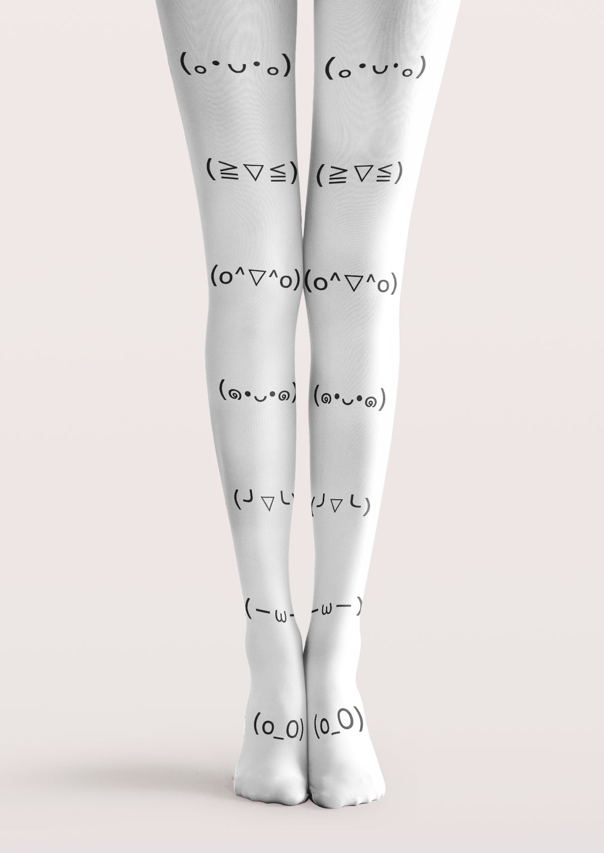 White printed tights with black emoticon faces in matching rows down both legs and across the tops of the feet