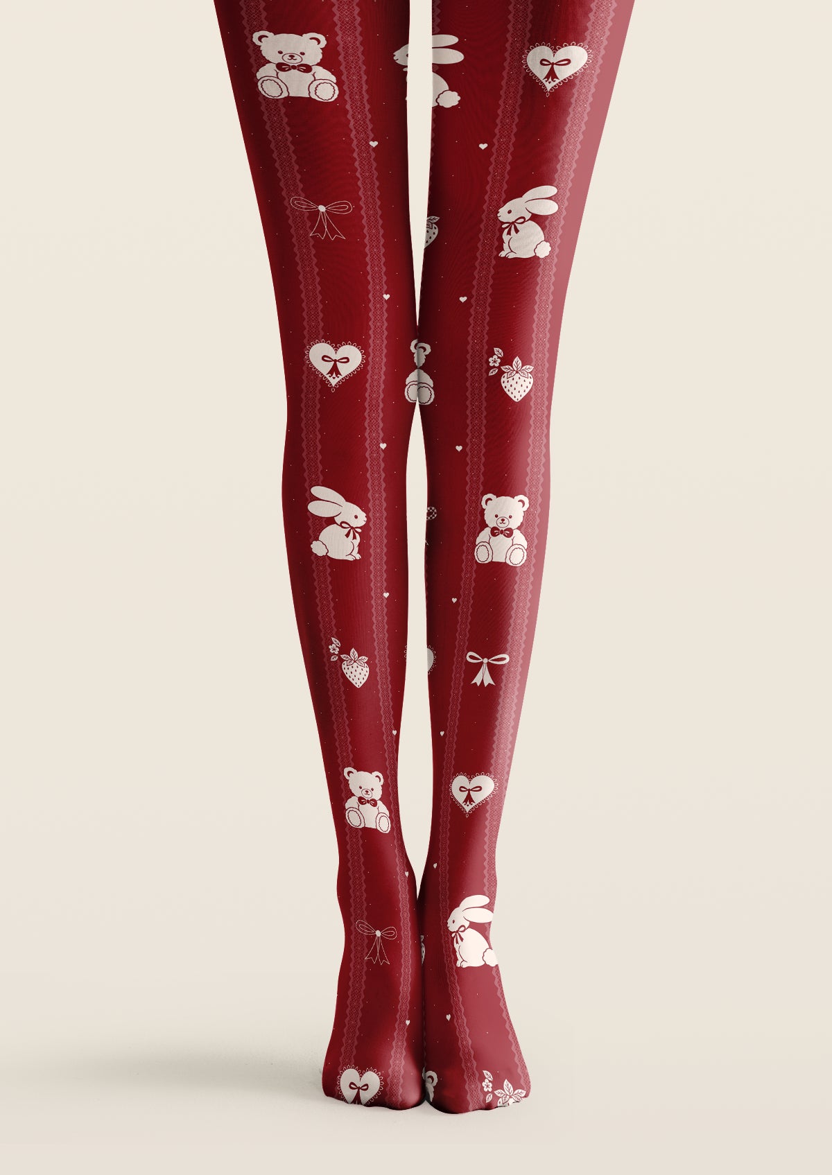 Red printed tights with ivory teddy bears, rabbits, hearts, strawberries, bows, and pink vertical borders