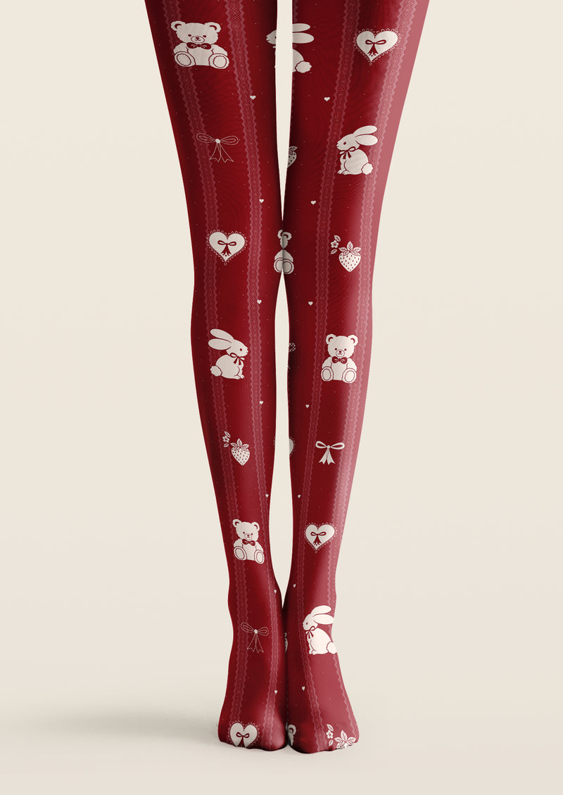 Red printed tights with ivory teddy bears, rabbits, hearts, strawberries, bows, and pink vertical borders