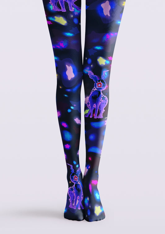 Black printed tights with purple one-eyed creatures and scattered colorful stars