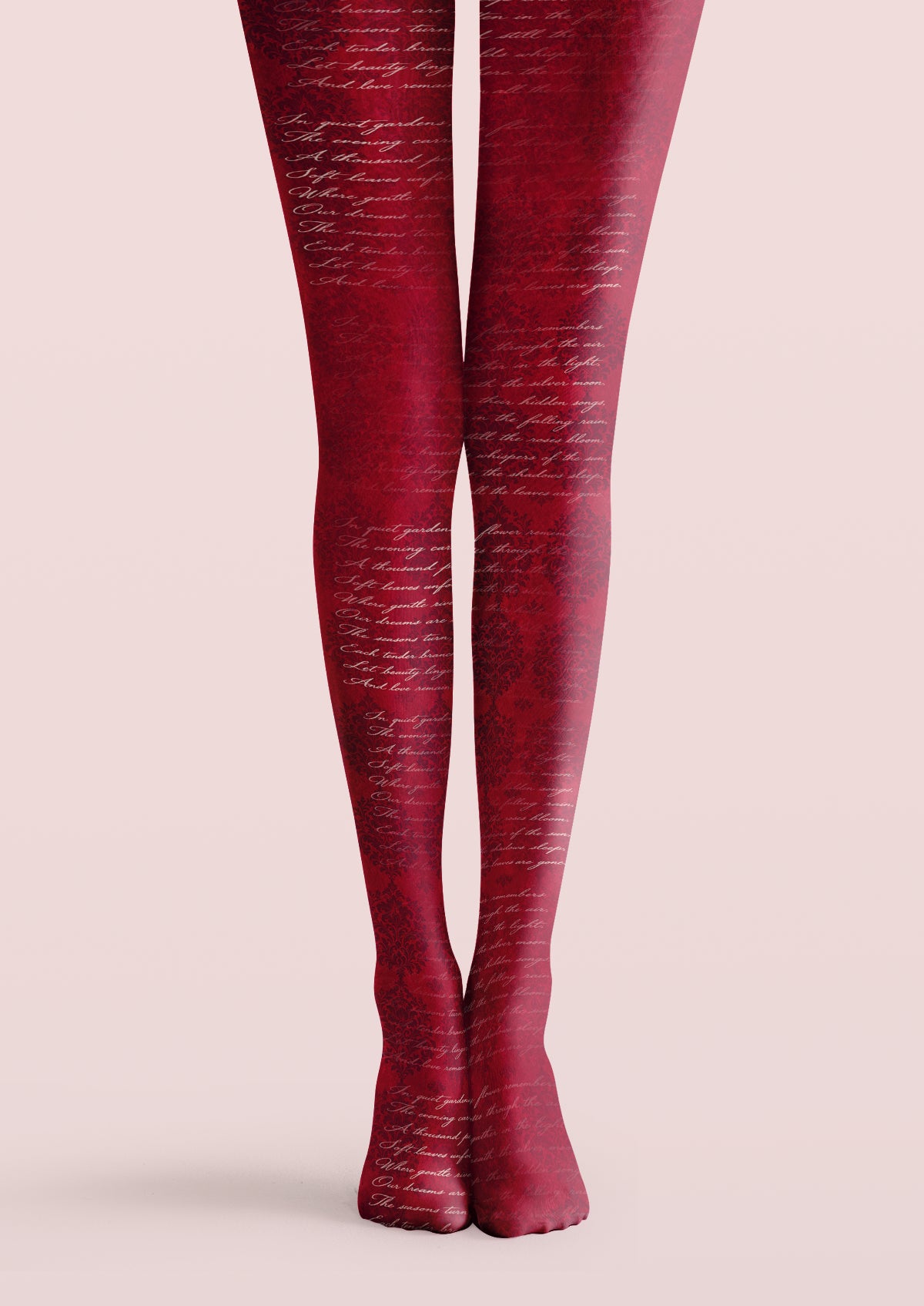 Red printed tights with pale cursive lettering layered over darker floral scrolls and ornamental leaves