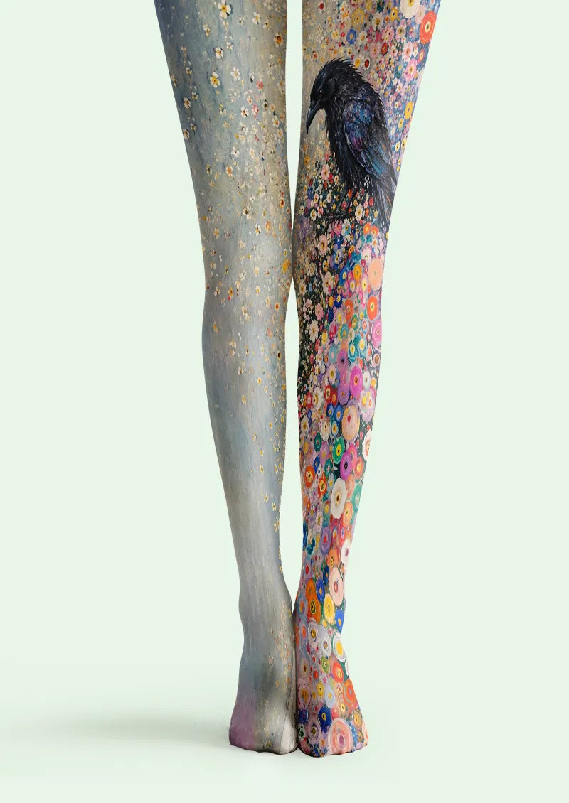 Blue printed tights with a dark raven and multicolor floral artwork