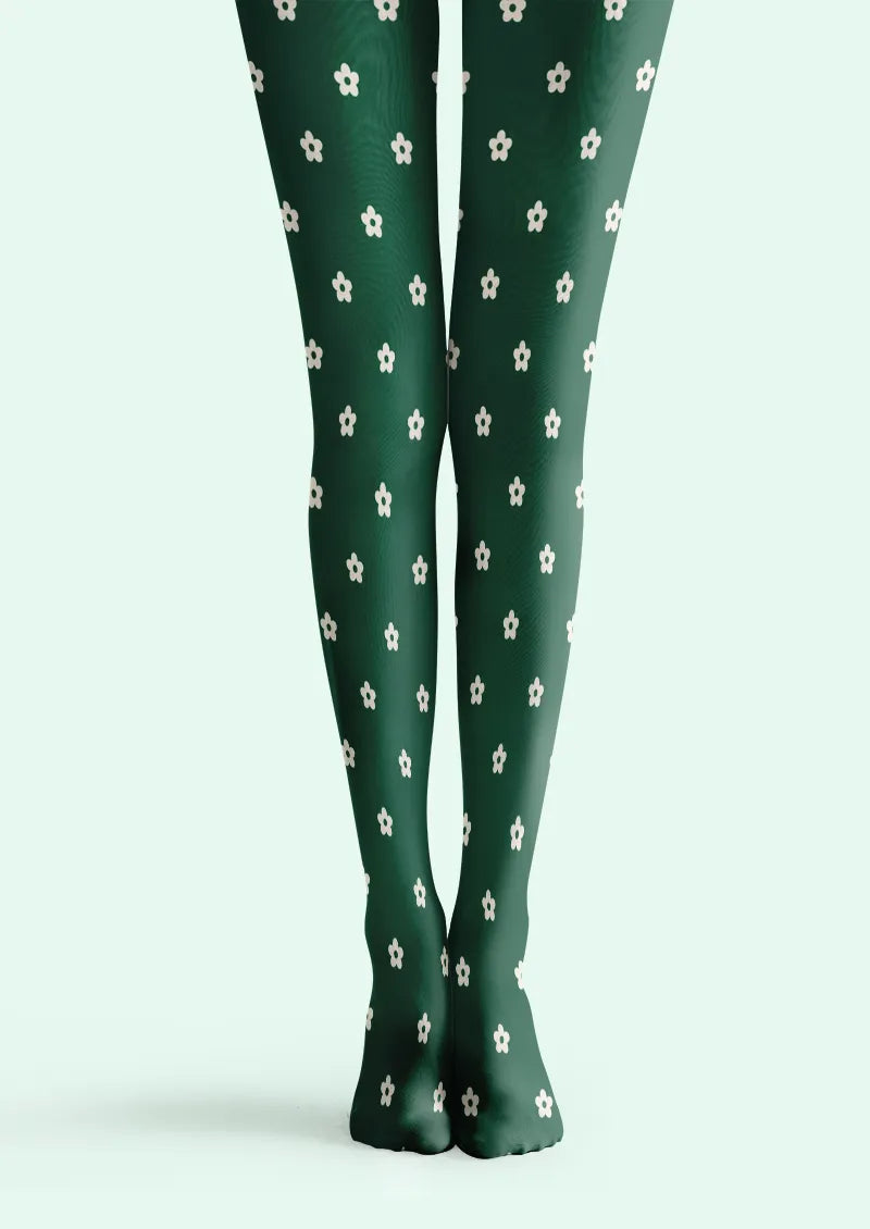 Green printed tights with evenly spaced small white five-petal flowers across both legs