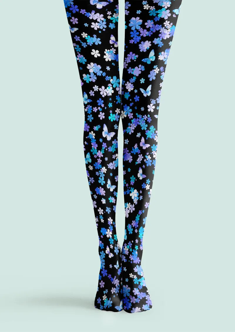 Black printed tights with blue and purple flowers and butterflies across both legs