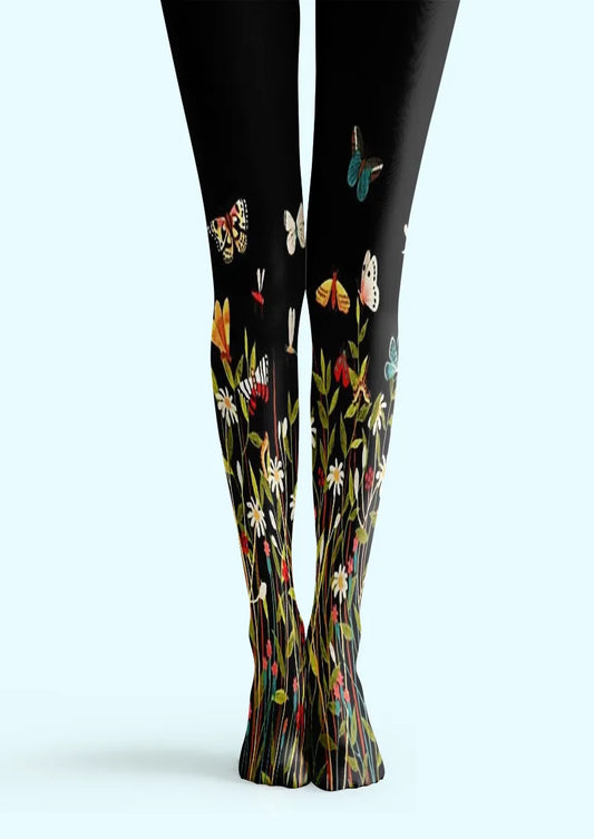 Black printed tights with wildflowers and colorful butterflies rising from the ankles