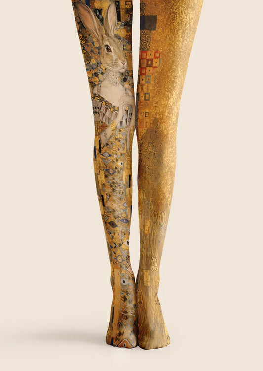 Yellow printed tights with a dressed rabbit portrait and ornate mosaic-like geometric details