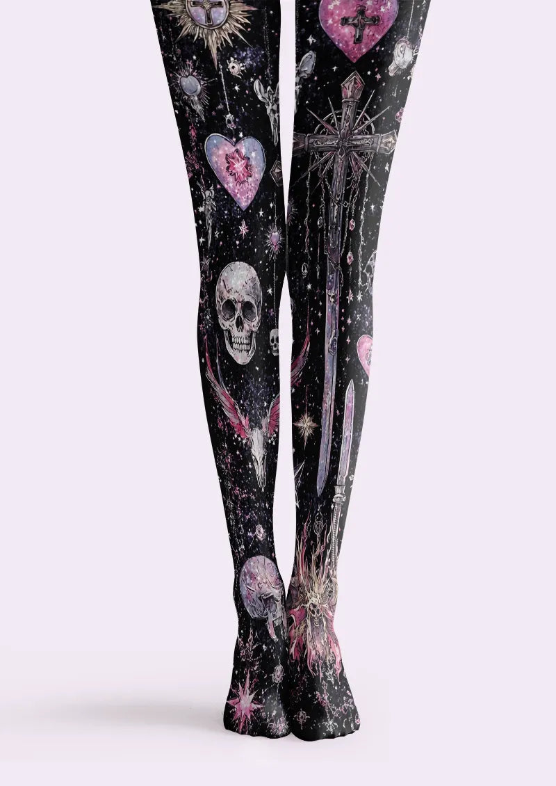 Black printed tights with gray skulls, ornate crosses, pink hearts and star-like details on both legs.