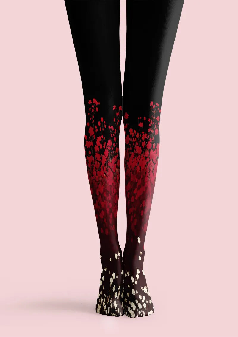 Black printed tights with red floral gradient and small white blossoms near the feet
